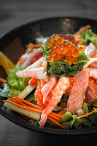 High angle view of chopped vegetables in plate on table