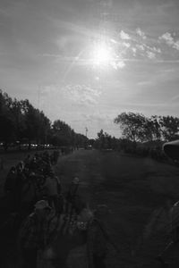 People in town square against sky