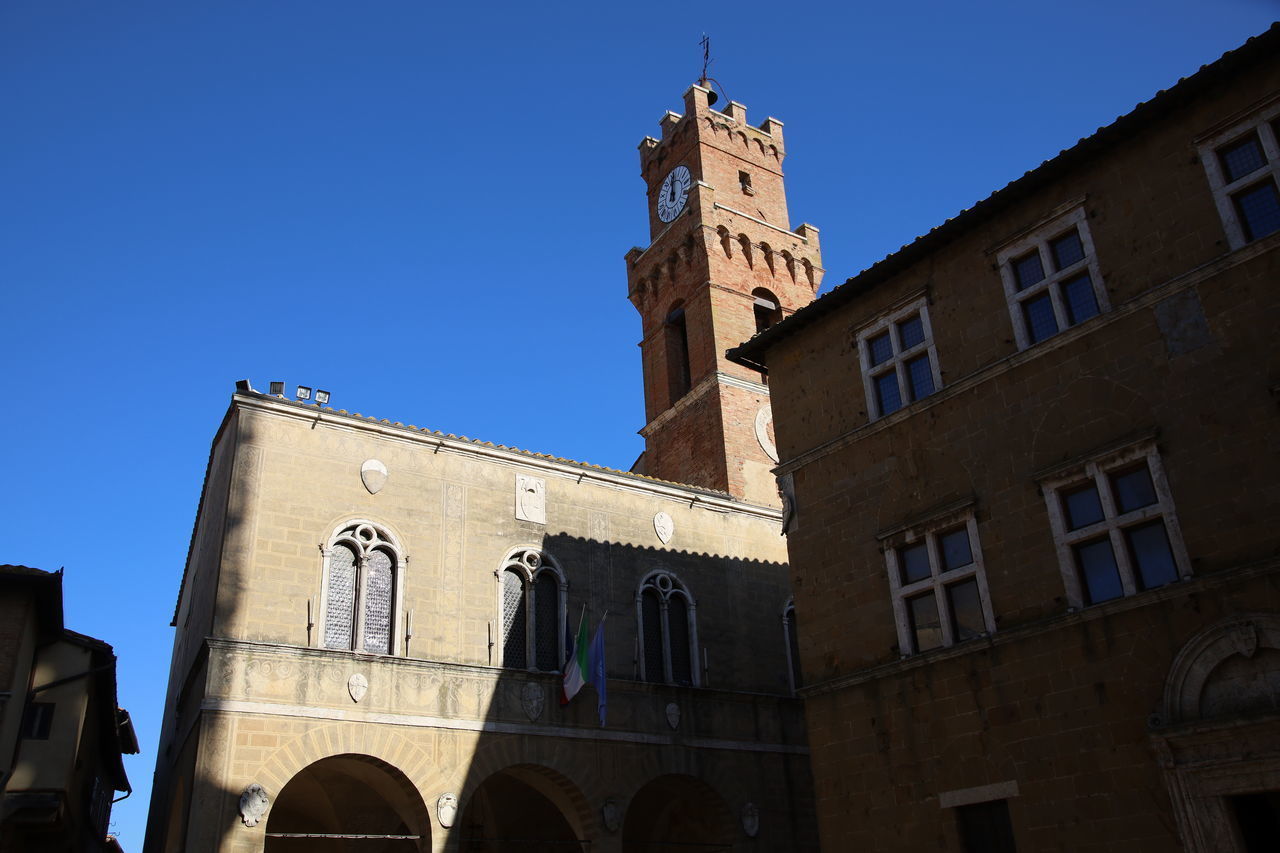 LOW ANGLE VIEW OF BUILDING AGAINST CLEAR BLUE SKY