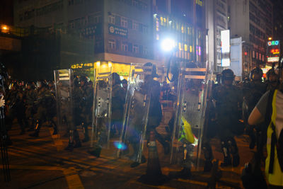 People on city street at night