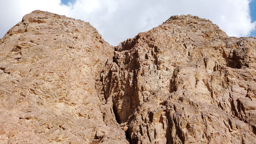 Low angle view of rock formations against sky