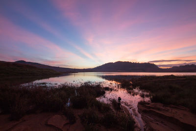 Panoramic view of lake against sky during sunset