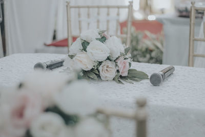 Close-up of white rose on table