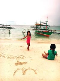 Woman standing on beach