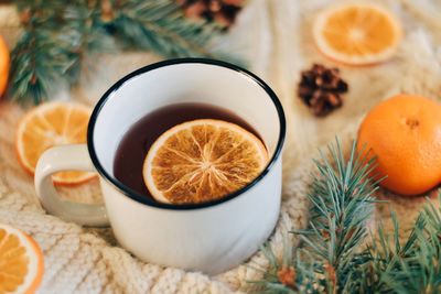 Close-up of orange slice in tea cup 