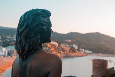 Rear view of statue against clear sky