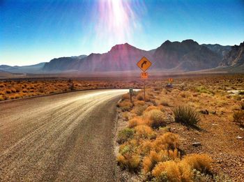 Country road leading towards mountains