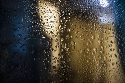 Full frame shot of wet glass window