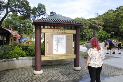 Woman in front of building