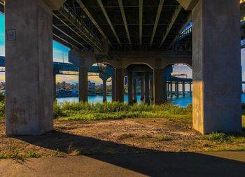 Underneath view of bridge across river 