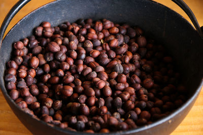 Close-up of roasted coffee beans on table