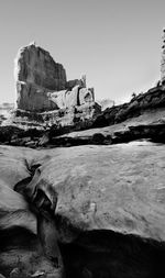 Rock formations on landscape against clear sky