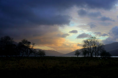 Scenic view of landscape against cloudy sky