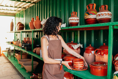 Rear view of woman looking at market stall