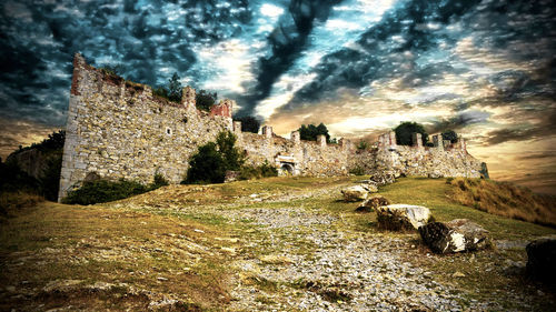 Old ruins against cloudy sky