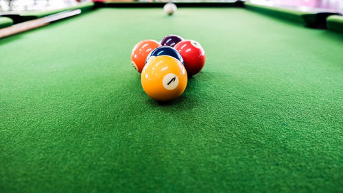 Close-up of colorful balls on pool table