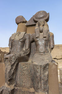 Low angle view of statue against sky