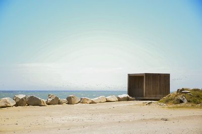 Scenic view of beach against clear sky