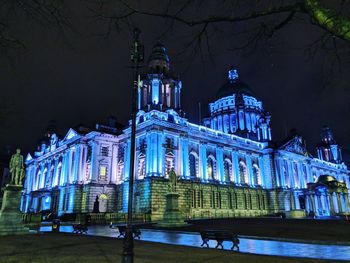 Low angle view of illuminated building at night