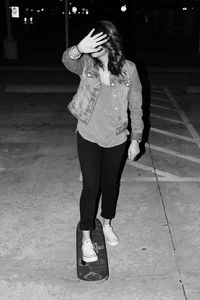 Full length of woman standing at night