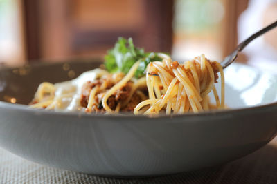 Close-up of noodles in bowl on table