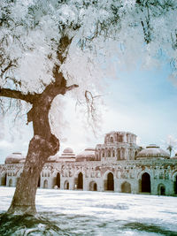 Historic building against sky during winter