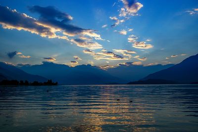 Scenic view of lake against cloudy sky