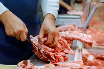 Midsection of man preparing food