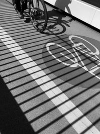 High angle view of shadow of bicycle on road