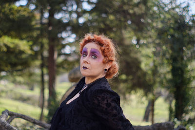 Portrait of young woman in forest