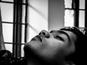 Close-up of boy sleeping at home