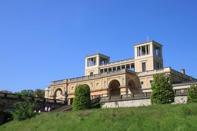 Low angle view of building against blue sky