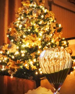 Close-up of illuminated christmas tree at home