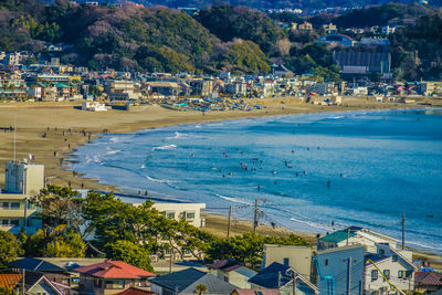 High angle view of buildings by sea