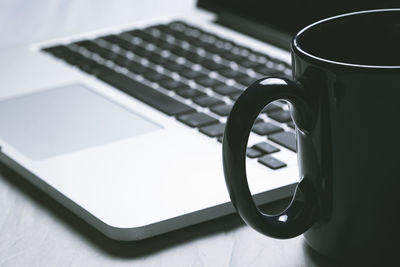 Close-up of coffee cup on table