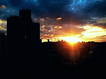 Silhouette of building at sunset