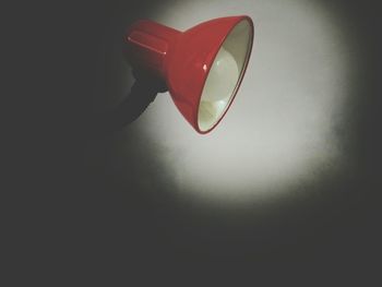 Close-up of heart shape on table against wall