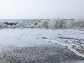 Scenic view of beach against clear sky