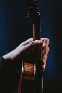Close up hand holding violin