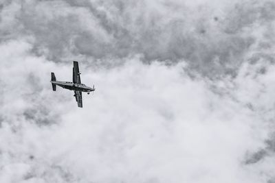 Low angle view of airplane flying in sky