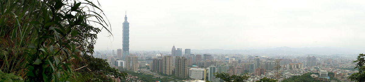 Modern buildings in city against sky