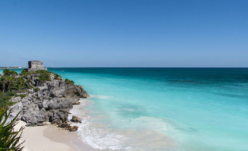 Scenic view of sea against clear blue sky