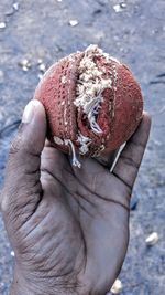 Close-up of hand holding ice cream