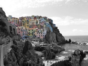 Panoramic view of sea and buildings against sky