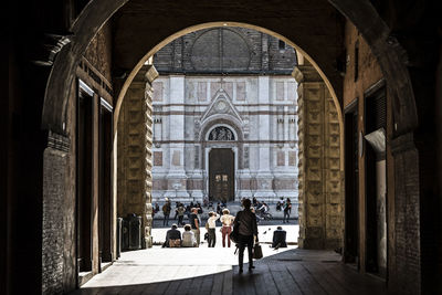 People walking in historic building