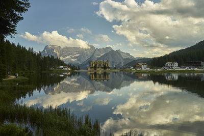 Scenic view of lake and mountains against sky