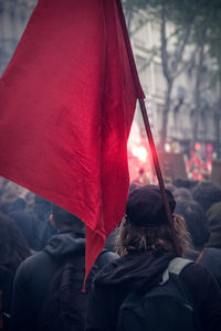 Rear view of people against blurred background