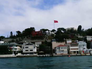 Scenic view of flag against sky