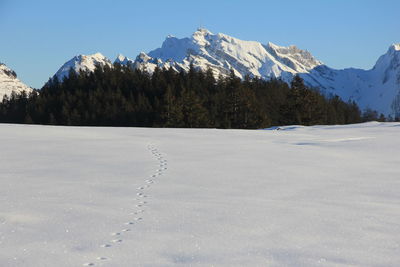 Scenic view of snowcapped mountains against sky