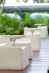 Empty chairs and table in room